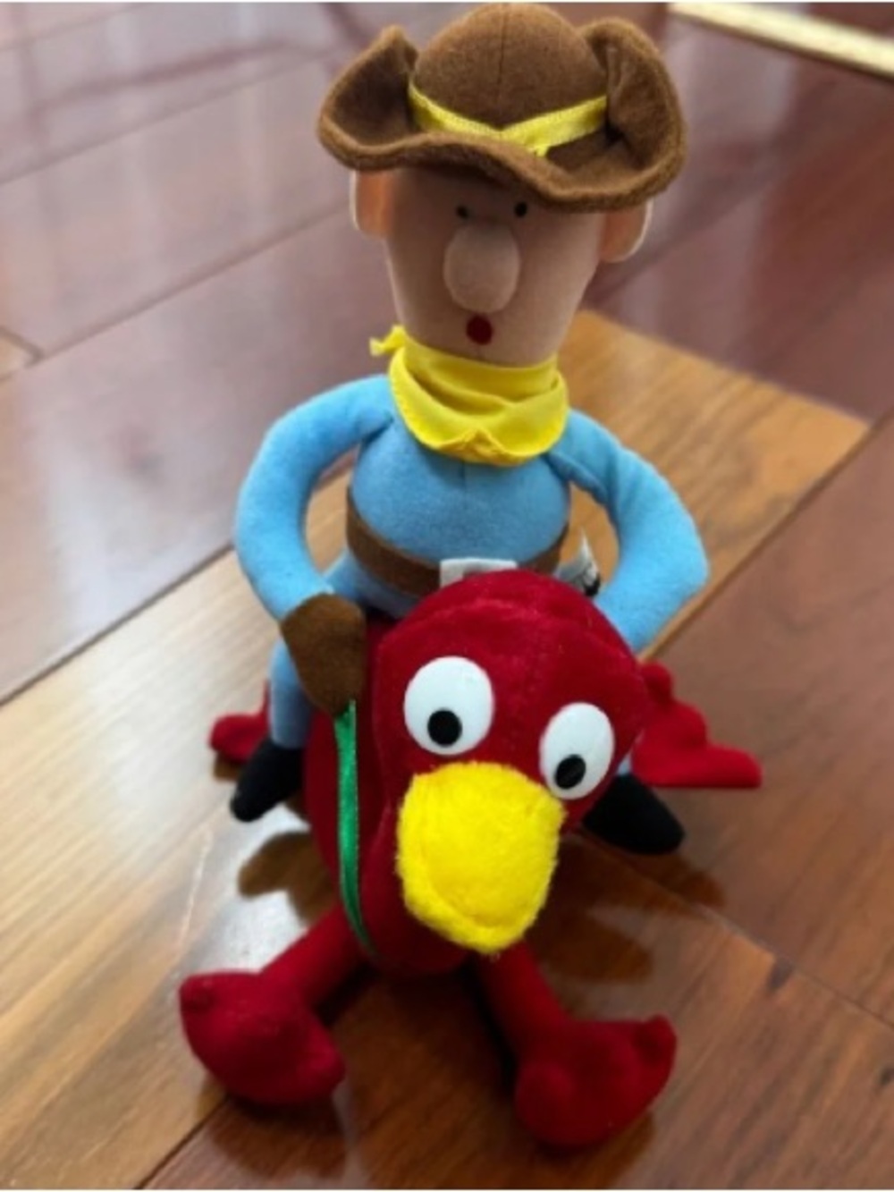 Red Plush Holiday Bird Pillow with Yellow Beak and Cowboy Rider
